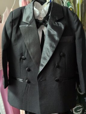 Black Kids' Tuxedo Incudes Jacket with Satin Lapels, Pants. Shirt, And Bow Tie